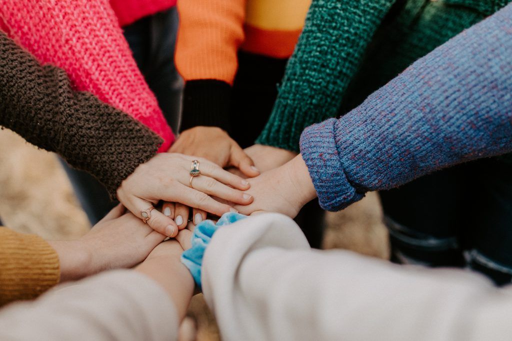 hands in a huddle