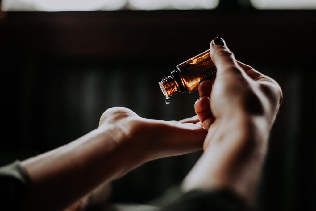 massage oil pouring into hand