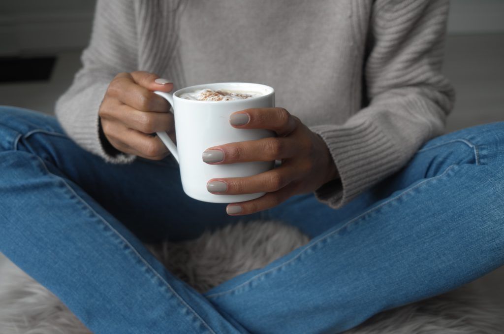 hands holding mug